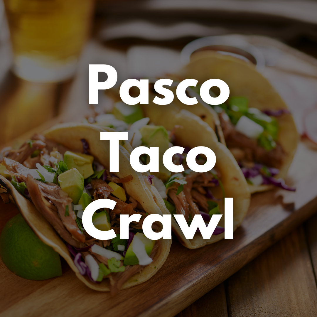 Photo of three tacos on a wood slab blurred with the text Pasco Taco Crawl over the top of the photo