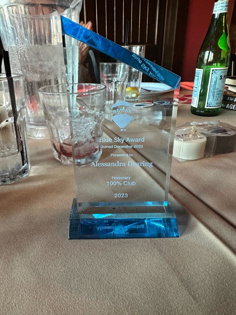Alessandra Dearing Award on Table at Remax Event